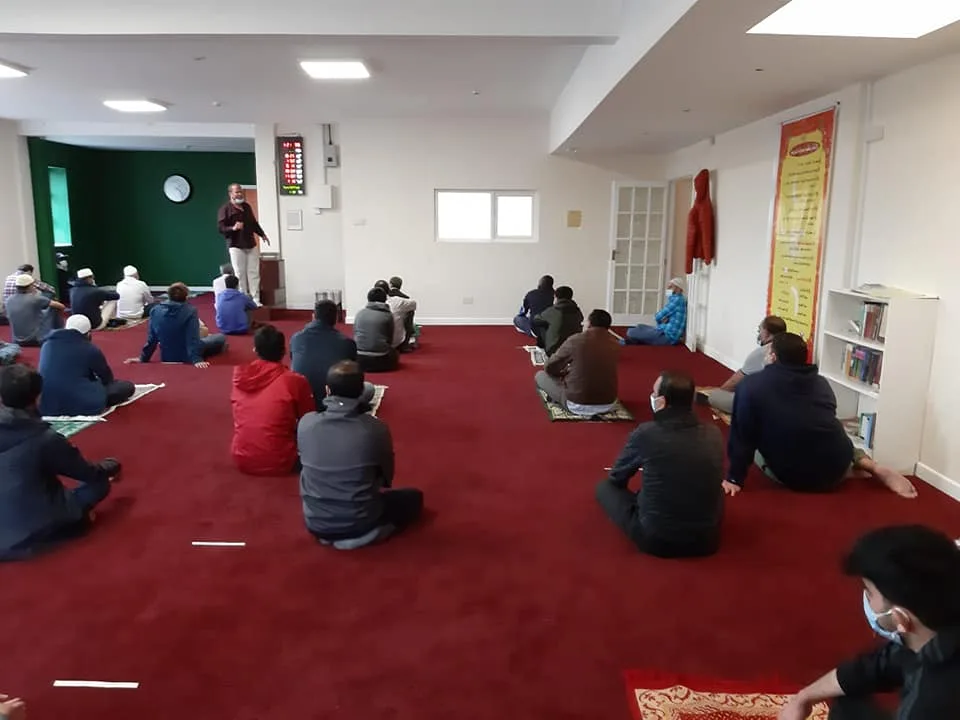 Community members gathered inside Carlow Masjid